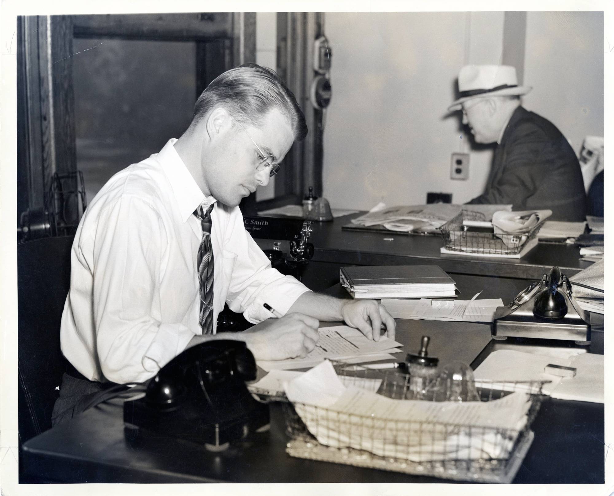 Ralph Hauenstein working at his editors desk
